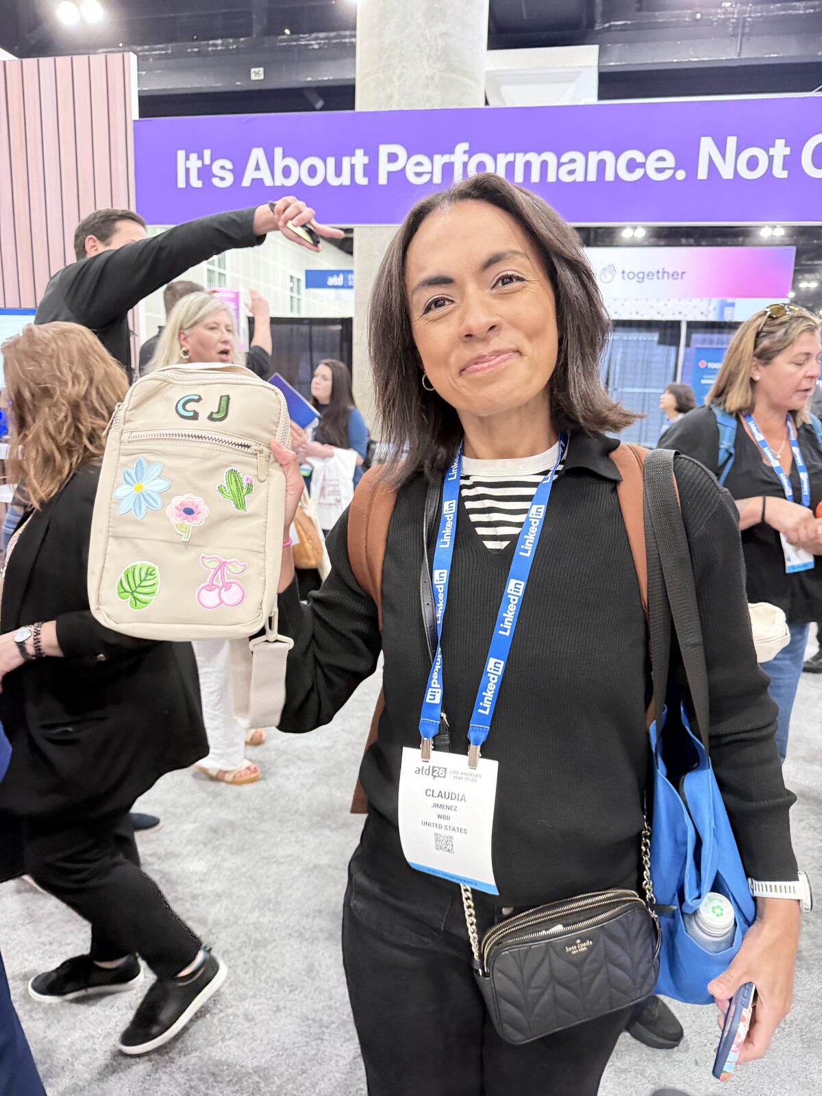 A wedding guest holding a personalized favor bag pressed at the station